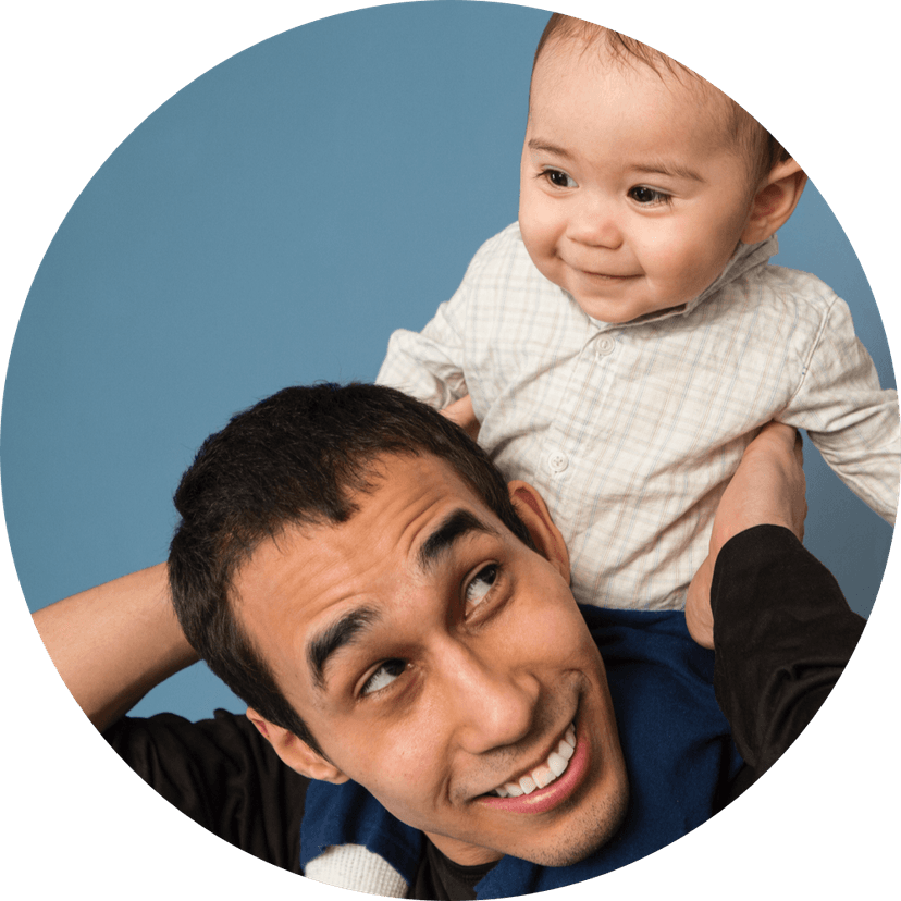 Baby on dad's shoulders.