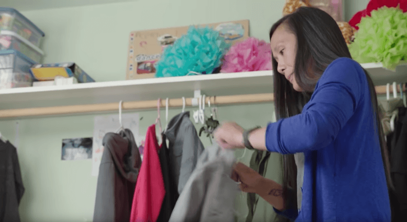 Mom hanging up clothes.